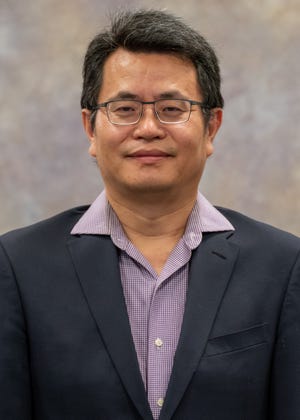 Meng Zhou, assistant professor of chemistry and materials engineering, leads the NMSU portion of a $ 6 million project with four universities to harness carbon dioxide emissions and use them to make energy and high value chemicals.