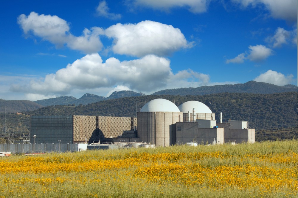 stock-photo-nuclear-power-plant-below-a-amazing-blue-sky-with-floffy-clouds-1855524643.jpg